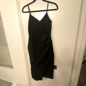 Black spaghetti straps lulus dress with small slit in the front. Slim fit